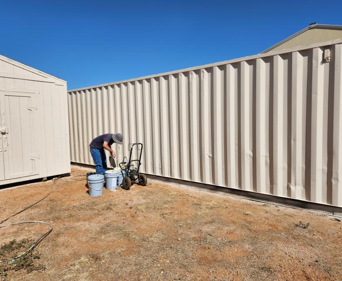 Staff at Southern Arizona Veterans' Memorial Cemetery in Sierra Vista painting shipping containers purchased from ADOA