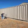 Staff at Southern Arizona Veterans' Memorial Cemetery in Sierra Vista painting shipping containers purchased from ADOA